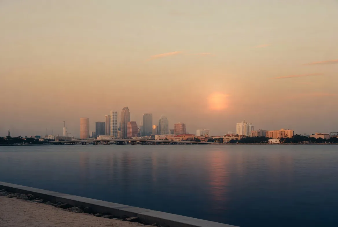 The Tampa–St. Petersburg waterfront skyline at golden hour.